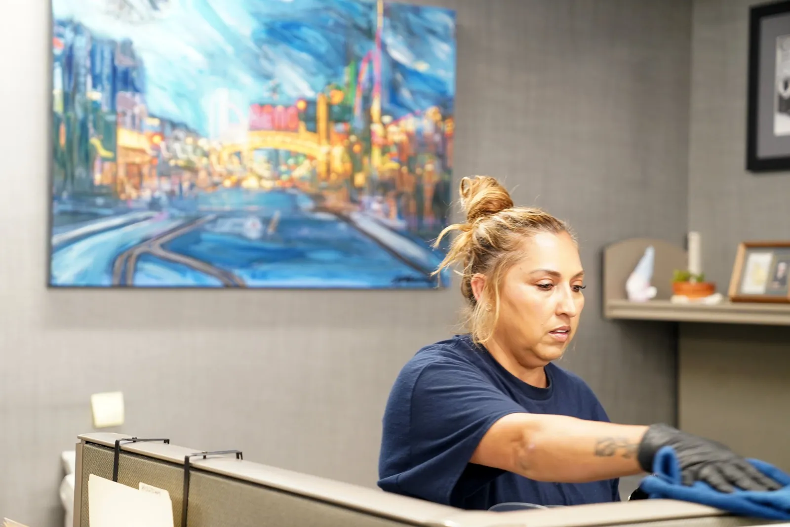 Reno Clean janitor wiping down an office desk